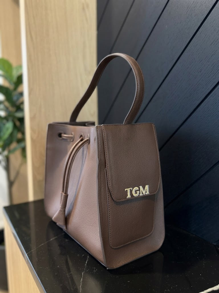 Hand-painted TGM initials on the front pocket of an Espresso Cove